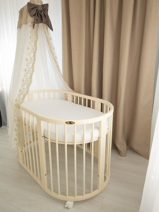 Patut oval Royal Sleep 9in1 Ivory - Meriess - Descoperă la Meriess o selecție premium de lenjerie de pat pentru bebeluși, pătuțuri multifuncționale, accesorii esențiale și cadouri speciale. Calitate garantată și livrare internațională. Suport 24/7 pentru toți părinții!